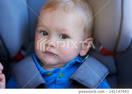 Road trip, baby and boy in car seat, portrait and safety with seat belt, travel and journey by transport. Vacation, cute toddler and child on vehicle for holiday, protection and adorable on drive Road trip, baby and boy in car seat, portrait and safety with seat belt, travel and journey by transport. Vacation, cute toddler and child on vehicle for holiday, protection and adorable on drive 142147043