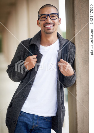 Smiling, student and portrait on wall with backpack, glasses and casual fashion in college for lecture. Gen z man, happy and ready on campus for lesson, class and learning for education or degree Smiling, student and portrait on wall with backpack, glasses and casual fashion in college for lecture. Gen z man, happy and ready on campus for lesson, class and learning for education or degree 142147099