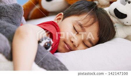 Asian boy, baby and sleeping in bedroom, home and nursery for peace, calm and dreaming at nap time. Tired, toys or young male kid resting for break, growth and healthy childhood development in house 142147100