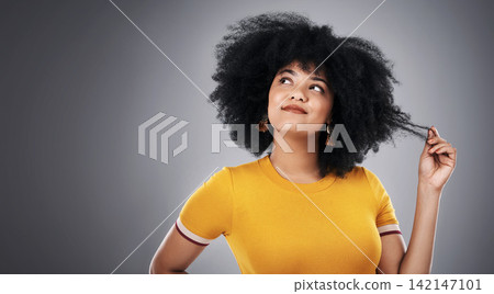 African woman, thinking and hair in studio for with ideas for natural texture, care and growth on gray background. Curly girl, model or person with hairstyle tips, choice and decision on banner space African woman, thinking and hair in studio for with ideas for natural texture, care and growth on gray background. Curly girl, model or person with hairstyle tips, choice and decision on banner space 142147101