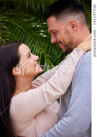 Happy couple, hug and affection with love for care, support or romance together in nature. Man, woman or lovers with smile in happiness for embrace, date or relationship on holiday at outdoor park Happy couple, hug and affection with love for care, support or romance together in nature. Man, woman or lovers with smile in happiness for embrace, date or relationship on holiday at outdoor park 142147316