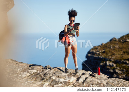 Mountain, hiking and backpack of woman with tablet for travel guide, networking or fitness blog update. Black person, health and exercise with technology for tourism, information or adventure in Peru Mountain, hiking and backpack of woman with tablet for travel guide, networking or fitness blog update. Black person, health and exercise with technology for tourism, information or adventure in Peru 142147373