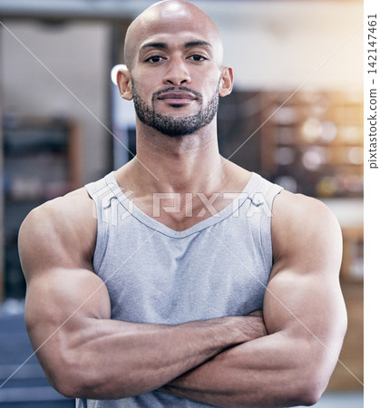 Man, portrait and arms crossed in gym with serious for training client, strong body and health career. Pride, muscle and face of personal trainer in wellness club for workout, sport and bodybuilder Man, portrait and arms crossed in gym with serious for training client, strong body and health career. Pride, muscle and face of personal trainer in wellness club for workout, sport and bodybuilder 142147461