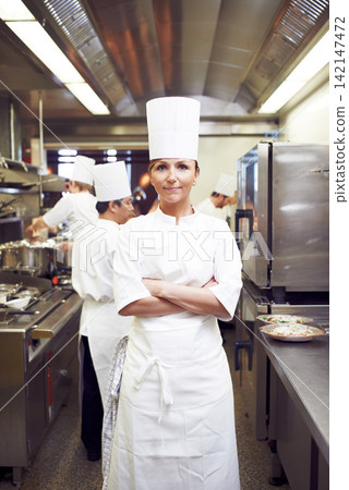 Arms crossed, woman and portrait of chef in restaurant for hospitality service, cuisine and pride. Fine dining, kitchen and cook with confidence in food industry for culinary, job or catering career Arms crossed, woman and portrait of chef in restaurant for hospitality service, cuisine and pride. Fine dining, kitchen and cook with confidence in food industry for culinary, job or catering career 142147472
