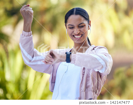 Woman, watch and fitness with fist pump for progress in health, wellness and exercise results outdoor. Happy, excited and win with app for workout stats, success and training with cheers in nature Woman, watch and fitness with fist pump for progress in health, wellness and exercise results outdoor. Happy, excited and win with app for workout stats, success and training with cheers in nature 142147477