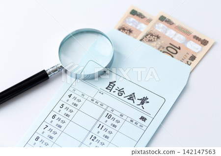 Neighborhood association fees and a magnifying glass Neighborhood association fees and a magnifying glass 142147563