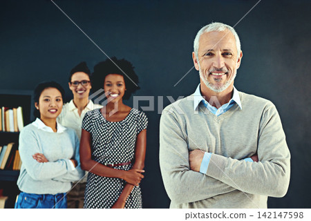 Mature, businessman and portrait or confident with colleagues for career, studio and manager on wall background. Male person, professional and proud of teamwork collaboration, leadership in startup Mature, businessman and portrait or confident with colleagues for career, studio and manager on wall background. Male person, professional and proud of teamwork collaboration, leadership in startup 142147598