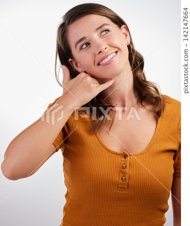 Thinking, smile and woman with call me hands in studio with memory, reflection or remember contact chat on white background. Insight, fantasy and model with dream of calling, hello or communication Thinking, smile and woman with call me hands in studio with memory, reflection or remember contact chat on white background. Insight, fantasy and model with dream of calling, hello or communication 142147664