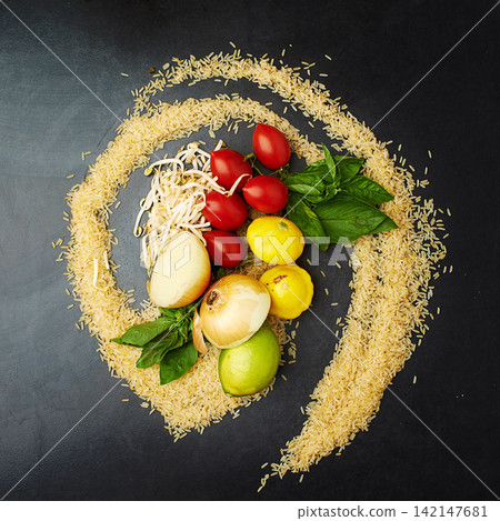 Fresh, food and nutrition in rice, tomatoes and counter top in kitchen or studio. Healthy, eating and recipe for wellness, health and cuisine with organic, vegetables and cooking for meal prep 142147681