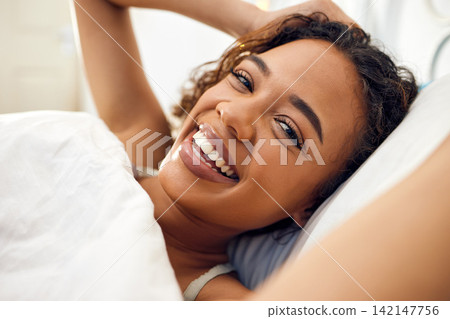 Morning, selfie and portrait of woman in bed with smile for internet, networking or update. Relax, influencer and photography in bedroom with happiness for memory, online content or social media post 142147756