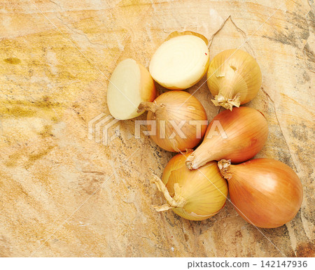Fresh, food and nutrition in sliced, onions and background in kitchen or studio. Healthy, eating and recipe for wellness, health and cuisine with organic, vegetables and cooking for meal prep Fresh, food and nutrition in sliced, onions and background in kitchen or studio. Healthy, eating and recipe for wellness, health and cuisine with organic, vegetables and cooking for meal prep 142147936