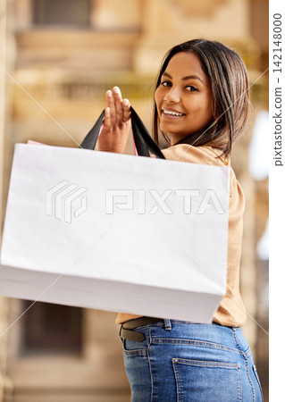 Portrait, shopping bag and woman in city happy on urban street for boutique, retail and clothing sale. Female person, packages and smile outdoors with luxury products for fashionable rich customer Portrait, shopping bag and woman in city happy on urban street for boutique, retail and clothing sale. Female person, packages and smile outdoors with luxury products for fashionable rich customer 142148000