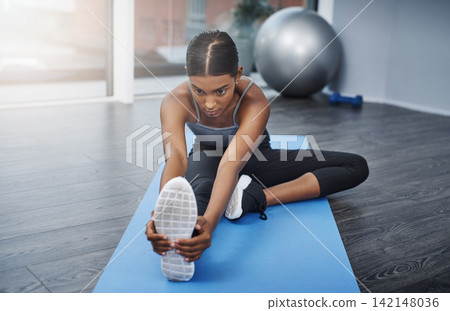 Yoga, girl and stretching legs warm up for fitness, hobby and workout before exercise at home. Female athlete, pilates and training for health, wellness and flexibility with endurance in sports Yoga, girl and stretching legs warm up for fitness, hobby and workout before exercise at home. Female athlete, pilates and training for health, wellness and flexibility with endurance in sports 142148036
