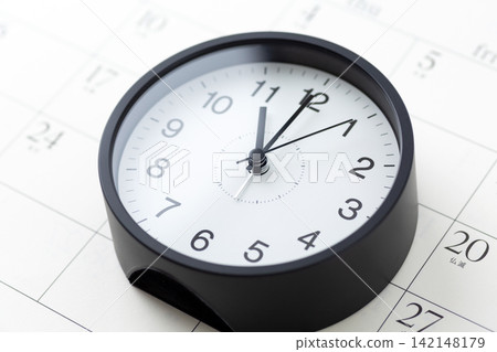 A clock and calendar showing 7 o'clock A clock and calendar showing 7 o'clock 142148179