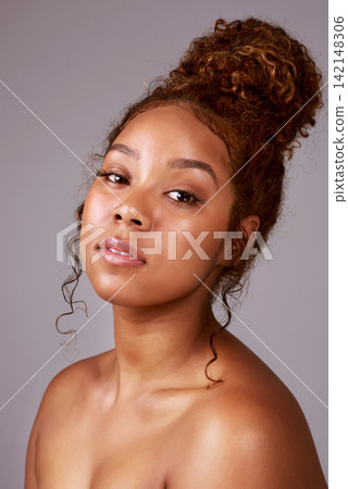 Woman, portrait and cosmetics or beauty in studio with glowing skin, facial treatment or dermatology. Skincare, model or person with confidence, healthy hair and self care routine on beige background 142148306