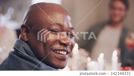 Dinner party, candles and portrait of African man with friends in house for birthday, celebration and food. Christmas meal, table and male person with people in home for social, holiday and eating Dinner party, candles and portrait of African man with friends in house for birthday, celebration and food. Christmas meal, table and male person with people in home for social, holiday and eating 142148331