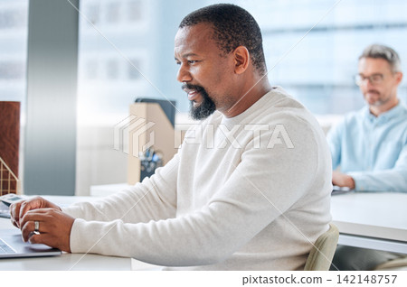 Coworking, office and black man with laptop creative project, writing or research online with productivity. Journalist, businessman or writer with hard work, typing article or reading news in England 142148757