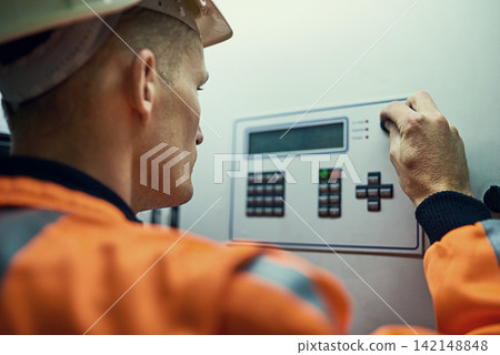 Panel, machine and man in electricity maintenance, engineering and industrial grid inspection. Renewable energy, production and technician checking electrical power system box for quality assurance Panel, machine and man in electricity maintenance, engineering and industrial grid inspection. Renewable energy, production and technician checking electrical power system box for quality assurance 142148848