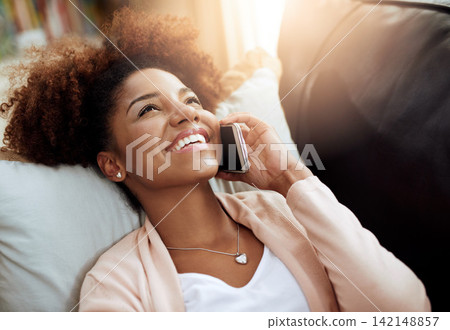 Woman, home and sofa or relax on phone call, chatting and living room for comfort on smartphone with internet. Conversation, laugh and funny discussion, listening and connected for communication 142148857