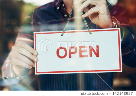 Open, sign and waiter at door of restaurant for small business, message or beginning of service. Coffee shop, hospitality hand and person with board by window for cafe, information or start of day Open, sign and waiter at door of restaurant for small business, message or beginning of service. Coffee shop, hospitality hand and person with board by window for cafe, information or start of day 142148937