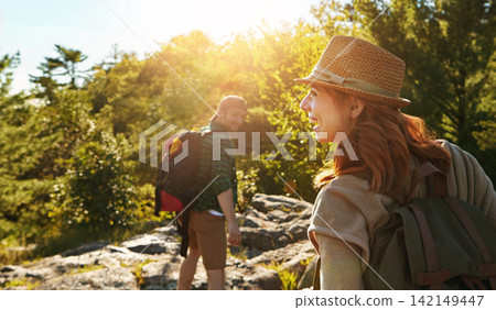 Couple, hiking and mountain travel for holiday, adventure and happy journey for bonding in nature. Outdoor, people and honeymoon vacation or date together, explore and love in jungle or wilderness Couple, hiking and mountain travel for holiday, adventure and happy journey for bonding in nature. Outdoor, people and honeymoon vacation or date together, explore and love in jungle or wilderness 142149447