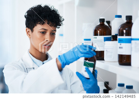 Pharmacy, doctor and woman with bottle of medicine, choice and reading of label for information. Clinic, medical and scientist with supplements, gloves and product for healthcare, wellness and help Pharmacy, doctor and woman with bottle of medicine, choice and reading of label for information. Clinic, medical and scientist with supplements, gloves and product for healthcare, wellness and help 142149485
