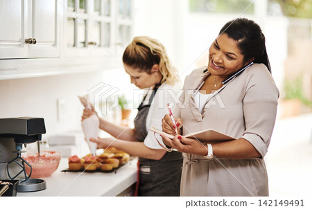 Woman, writing or phone call for cooking order, talking or meal ingredients in house kitchen for supply. Startup, listen or happy baker with cake in mobile discussion, communication or conversation Woman, writing or phone call for cooking order, talking or meal ingredients in house kitchen for supply. Startup, listen or happy baker with cake in mobile discussion, communication or conversation 142149491
