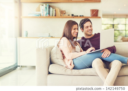Laptop, happy and couple on sofa in living room browsing for movie, show or film together at home. Smile, love and people relax and streaming funny, comic or comedy video on computer or technology Laptop, happy and couple on sofa in living room browsing for movie, show or film together at home. Smile, love and people relax and streaming funny, comic or comedy video on computer or technology 142149750