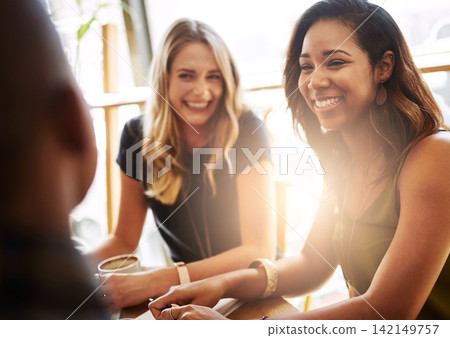 Funny, group and friends drinking coffee in shop for conversation, talking or social gathering together in restaurant. Happy women, students and relax in cafe for chat, news or laugh at gossip story Funny, group and friends drinking coffee in shop for conversation, talking or social gathering together in restaurant. Happy women, students and relax in cafe for chat, news or laugh at gossip story 142149757