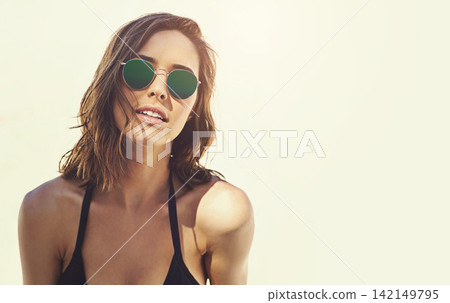 Woman, face and sunglasses for holiday at beach in summer, mockup and plain background. Travel, adventure and girl with beauty and style on vacation in Bali, island or Indonesia with sunshine on sand Woman, face and sunglasses for holiday at beach in summer, mockup and plain background. Travel, adventure and girl with beauty and style on vacation in Bali, island or Indonesia with sunshine on sand 142149795