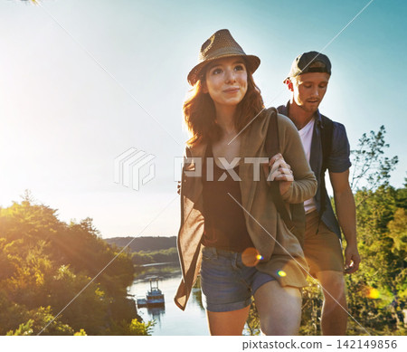 Happy, woman and couple with hiking outdoor for travel adventure, sightseeing nature and bonding. Space, people and walking with smile for trekking date, exploring trail and holiday hobby on weekend Happy, woman and couple with hiking outdoor for travel adventure, sightseeing nature and bonding. Space, people and walking with smile for trekking date, exploring trail and holiday hobby on weekend 142149856