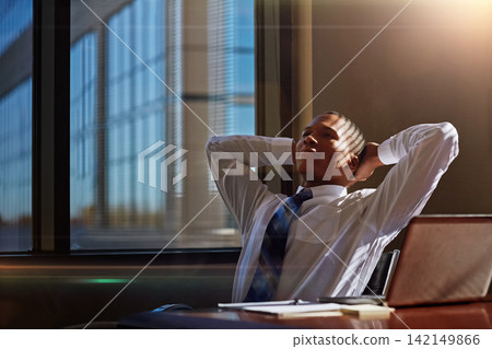 Black man, business and relax for achievement in office or career victory for good news, promotion or deal. Male person, desk and future thinking for corporate confidence laptop email, rest or break Black man, business and relax for achievement in office or career victory for good news, promotion or deal. Male person, desk and future thinking for corporate confidence laptop email, rest or break 142149866