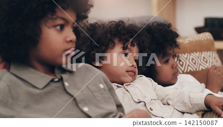 Children, relax and watching tv on couch with siblings together for movie subscription, network and decision for cartoon. Boys, sofa and rest in lounge for kids show and streaming service in Colombia Children, relax and watching tv on couch with siblings together for movie subscription, network and decision for cartoon. Boys, sofa and rest in lounge for kids show and streaming service in Colombia 142150087