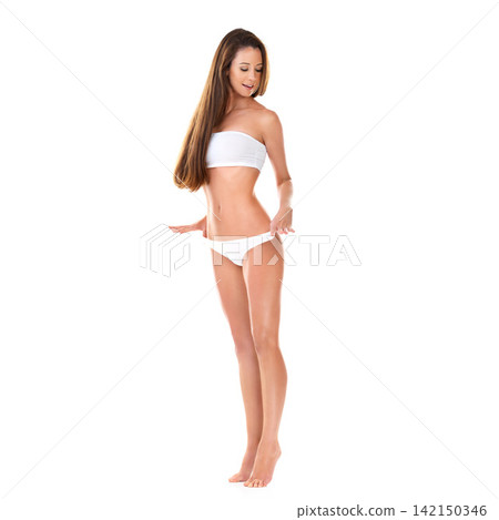 Studio, weight loss and girl in underwear with healthy body, confidence and excited in mockup space. Fashion, fitness results and happy woman with wellness, diet and isolated on white background. Studio, weight loss and girl in underwear with healthy body, confidence and excited in mockup space. Fashion, fitness results and happy woman with wellness, diet and isolated on white background. 142150346