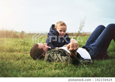 Family, grass and father with baby in park for bonding, playing and laugh together outdoors. Nature, field and happy dad relax with young boy for child development, love or fun on weekend or holiday Family, grass and father with baby in park for bonding, playing and laugh together outdoors. Nature, field and happy dad relax with young boy for child development, love or fun on weekend or holiday 142150424