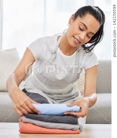 Happy woman, laundry and folding with stack on sofa for clean clothing, chores or housekeeping at home. Female person, cleaner or maid with dry washing or pile for neat and tidy apartment or house Happy woman, laundry and folding with stack on sofa for clean clothing, chores or housekeeping at home. Female person, cleaner or maid with dry washing or pile for neat and tidy apartment or house 142150594