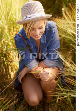 Woman, smile and peace in outdoor wheat field, spring and relax in sustainable nature. Female person, happy and travel to meadow on summer holiday or vacation, environment and trip to countryside Woman, smile and peace in outdoor wheat field, spring and relax in sustainable nature. Female person, happy and travel to meadow on summer holiday or vacation, environment and trip to countryside 142150665