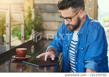 Man, tablet and cafe with relax, tech and online or freelancer, remote work and male person. Typing, email and internet connection in copywriting, writer job and seo research at coffee shop Man, tablet and cafe with relax, tech and online or freelancer, remote work and male person. Typing, email and internet connection in copywriting, writer job and seo research at coffee shop 142150700