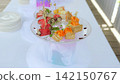 Gourmet appetizer plate displaying vibrant salmon toasts, sesame crusted ham rolls, and juicy watermelon slices, highlighting sophisticated culinary presentation 142150767
