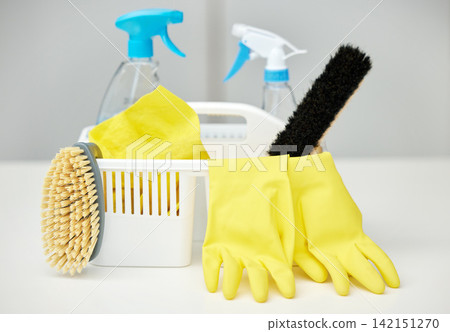 Table, brush or basket with cleaning supplies, spray bottle or chemical for bacteria, wellness or dirty mess. Grey background, maid service or ready for washing with product, liquid soap or gloves Table, brush or basket with cleaning supplies, spray bottle or chemical for bacteria, wellness or dirty mess. Grey background, maid service or ready for washing with product, liquid soap or gloves 142151270