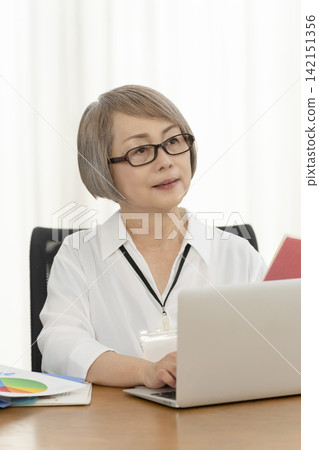 Senior women working in an office Senior women working in an office 142151356