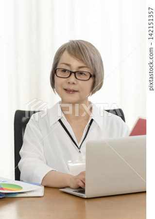 Senior women working in an office Senior women working in an office 142151357