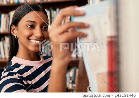 Smile, girl and bookshelf with choice at library for education, knowledge or literature research. Happy, student and option of book at campus for philosophy study, decision and learning at university Smile, girl and bookshelf with choice at library for education, knowledge or literature research. Happy, student and option of book at campus for philosophy study, decision and learning at university 142151440