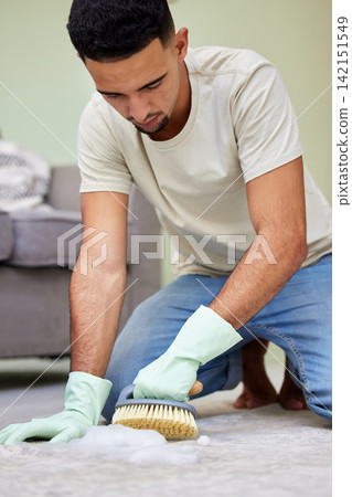 Man, scrub and cleaning floor in house for hygiene, maintenance and washing carpet in living room. Male person, brush and soap on ground for disinfection, housekeeping and detergent in apartment Man, scrub and cleaning floor in house for hygiene, maintenance and washing carpet in living room. Male person, brush and soap on ground for disinfection, housekeeping and detergent in apartment 142151549