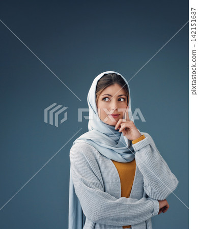 Fashion, thinking and muslim woman with idea in studio isolated on a blue background mockup space. Serious, dream and Islamic person in hijab for vision, inspiration or decision with casual clothes Fashion, thinking and muslim woman with idea in studio isolated on a blue background mockup space. Serious, dream and Islamic person in hijab for vision, inspiration or decision with casual clothes 142151687