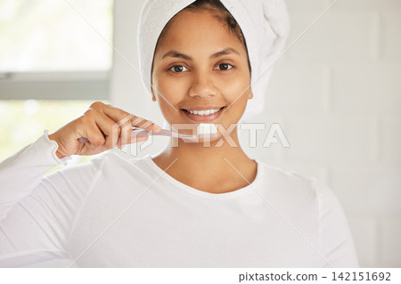 Indian woman, portrait and toothbrush for brushing teeth with smile for cleaning, morning or whitening. Female person, face and gum health for bacteria hygiene in home bathroom, self care or routine Indian woman, portrait and toothbrush for brushing teeth with smile for cleaning, morning or whitening. Female person, face and gum health for bacteria hygiene in home bathroom, self care or routine 142151692