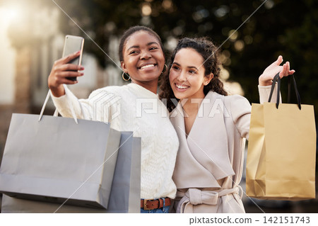 Selfie, smile and women for photography for memory by mall, sale or retail together outdoor by store. Happy people, lens flare and friends with smartphone for online shopping, discount and fashion Selfie, smile and women for photography for memory by mall, sale or retail together outdoor by store. Happy people, lens flare and friends with smartphone for online shopping, discount and fashion 142151743