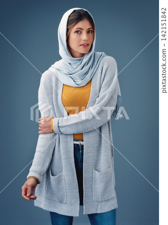 Portrait, studio and fashion with arab woman, clothes for Ramadan with modesty for religion and faith. Eco friendly, material hijab with Saudi model, trendy and confident for islamic culture Portrait, studio and fashion with arab woman, clothes for Ramadan with modesty for religion and faith. Eco friendly, material hijab with Saudi model, trendy and confident for islamic culture 142151842