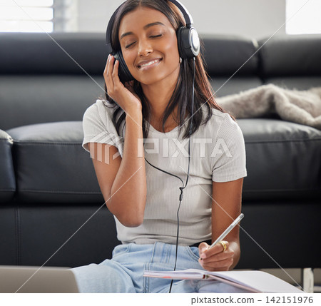 Headphones, notebook and woman writing with music, journal for notes and peaceful audio with inspiration at home. Schedule, calendar or planner, listening to radio and relax for wellness or self care Headphones, notebook and woman writing with music, journal for notes and peaceful audio with inspiration at home. Schedule, calendar or planner, listening to radio and relax for wellness or self care 142151976