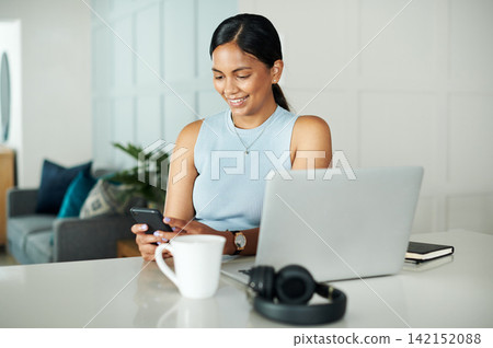 Laptop, coffee and woman with phone in kitchen networking on website, internet or mobile app. Technology, smile and female person typing email on cellphone by counter with computer in apartment. Laptop, coffee and woman with phone in kitchen networking on website, internet or mobile app. Technology, smile and female person typing email on cellphone by counter with computer in apartment. 142152088
